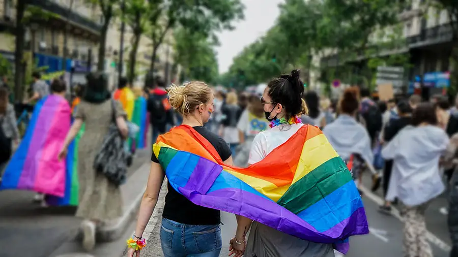 Lesbian couple celebrates in a Pride parade