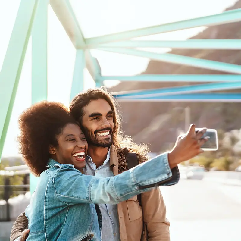 affiliates taking a selfie on a bridge